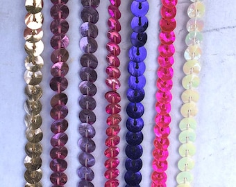 1 yard of single strand Metallic Sequin Trim 1/4" wide in many colors.