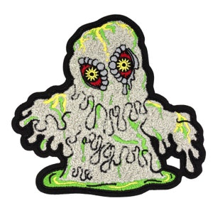 May include: A gray and green embroidered patch of a melting ghost with red eyes and the text "Boo Ya'll" in white.