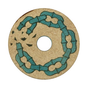 May include: A circular, tan-colored object with a teal chain-like design encircling a central hole. The chain appears to be made of bamboo-like segments. Small black shapes are scattered around the chain.