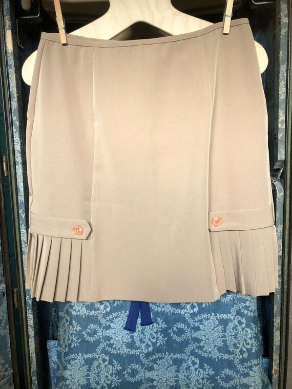 Khaki colored pleated skirt