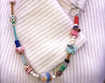 This necklace speaks to the  crazy, fun, colorful, exotic, curious, and alluring personality.