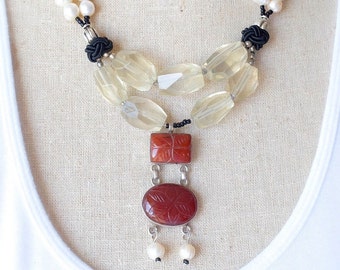 Here's how to wear WOW! Freshwater pearls, golden citrine and earthy red carved carnelian. A beautiful strand of nature to call your own.n.