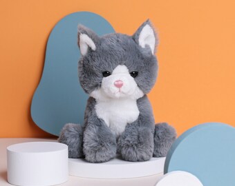 gray and white stuffed cat