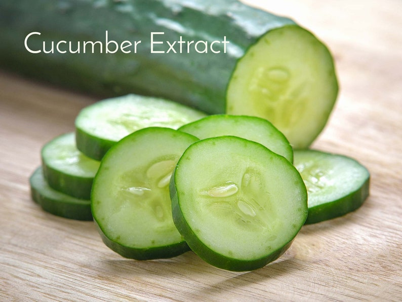 May include: Cucumber Extract. A whole cucumber and several slices of cucumber on a wooden surface.