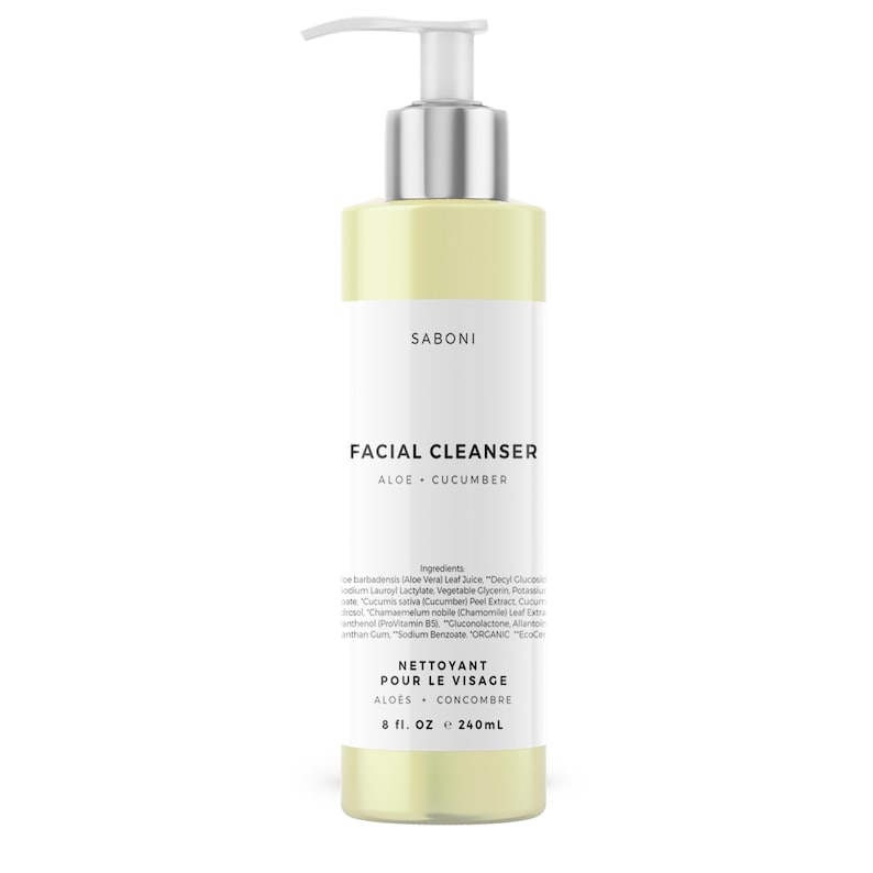 May include: A clear plastic bottle of facial cleanser with a silver pump top. The bottle is labeled "SABONI FACIAL CLEANSER ALOE CUCUMBER" and "NETTOYANT POUR LE VISAGE ALOES CONCOMBRE 8 fl. OZ e 240mL".