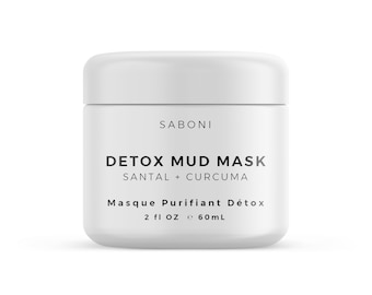 Può includere: Un barattolo bianco di maschera di fango detox Saboni. L'etichetta presenta il testo "DETOX MUD MASK" con "SANTAL + CURCUMA" sotto. La parte inferiore dell'etichetta recita "Masque Purifiant Détox" e "2 fl oz e 60ml".