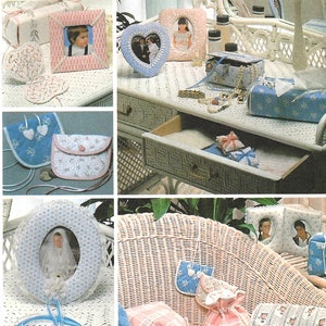 May include: A collection of handmade items featuring a blue and white floral pattern. The items include a picture frame, a small purse, a vanity set, and a decorative pillow. The items are all made with a delicate lace trim.