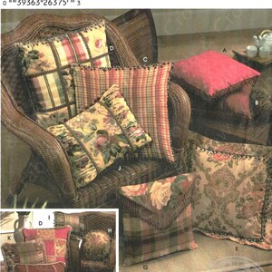 May include: A Simplicity sewing pattern for beaded pillows. The pattern number is 5685. The pattern includes instructions for making pillows with different fabric designs, including plaid, floral, and paisley. The pattern also includes instructions for adding beaded trim to the pillows.