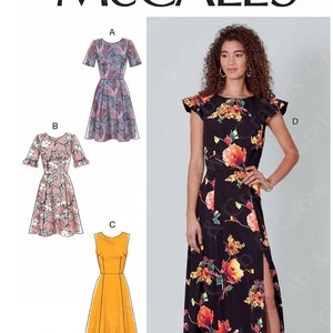 May include: McCall's M7971 sewing pattern. The pattern includes options for dresses A, B, C, and D. Dress D is a black floral print maxi dress with a high slit. The pattern includes sizes A5 (6-8-10-12-14).