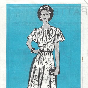 May include: A black and white illustration of a dress pattern. The dress has a ruffled neckline and short sleeves. The pattern is for sizes 8-10-12 and 14-16-18-20. The pattern number is 4520.