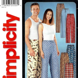 May include: Simplicity sewing pattern 9871 for pajama pants. The pattern features a man and woman wearing pajama pants with various prints, including a beige print with golf clubs and a blue print with white hearts. The text "IT'S SO easy" is visible.