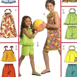 May include: McCall's sewing pattern M5419 for girls' clothing. The pattern includes options for dresses, tops, and shorts. The image shows illustrations of the finished garments in various colors and patterns, including floral and polka dot designs.
