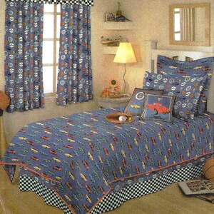 May include: Simplicity Home bedding accessories pattern. The image shows a child's bedroom set with a blue car-themed comforter, curtains, and pillowcases. The curtains and bed skirt have a black and white checkered pattern.