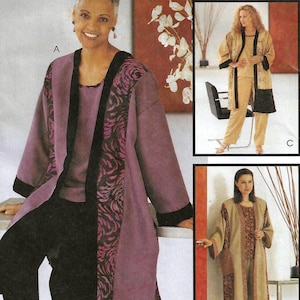 May include: McCall's sewing pattern 2292. The pattern features a woman wearing a purple and black outfit. The text "FIT FOR REAL PEOPLE" and "FASHION FOR EVERYBODY" is visible. The pattern includes sizes XXL (24,26).