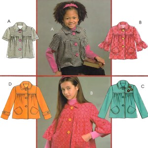 May include: McCall's sewing pattern featuring four children's jacket designs. The pattern includes illustrations of jackets in orange, teal, pink, and black and white checkered fabrics. The McCall's logo and text are at the top.