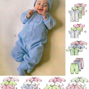 May include: McCall's sewing pattern 9407 featuring a baby in a blue jumpsuit and hat. The pattern includes various baby clothing designs in pink, green, and blue. The pattern is for all sizes in one envelope.