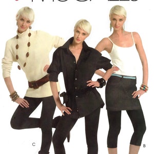 May include: Three women modeling different styles of black cropped pants. The pants have a lace trim at the bottom. The women are wearing different tops, including a white turtleneck, a black button-down shirt, and a white tank top. The image includes the text "Easy McCall's" and "Overlock/Serger Tips".