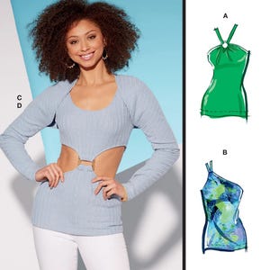 May include: McCall's sewing pattern M8323 featuring a woman wearing a light blue top with cut-out details and a matching long-sleeve shrug. The pattern includes multiple view options. The text reads "Designed and printed in USA."