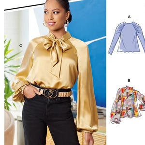 May include: A McCall's sewing pattern featuring a woman wearing a gold satin blouse with a bow and black pants. The pattern includes multiple view options. The image also shows illustrations of two blouse designs. The text "#WaverlyMcCalls" is visible.