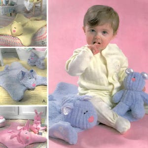 May include: McCall's Crafts pattern M4541. The image shows a baby with a blue stuffed bear and a blue plush animal-shaped rug. The pattern includes instructions for making various plush animal rugs and toys. The text "McCall's Crafts" is at the top.
