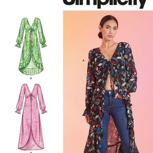 May include: Simplicity pattern S9747 features three long-sleeve dress designs. The image shows a woman wearing a black floral print dress with a tie front. The pattern includes a green leaf print dress and a pink polka dot dress.