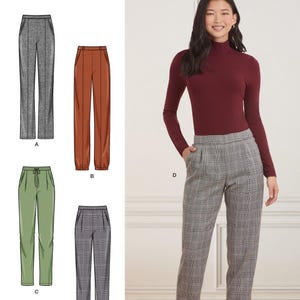 May include: Simplicity sewing pattern S9376 featuring four variations of trousers. The pattern includes illustrations of grey, rust, green, and plaid pants, alongside a photograph of a model wearing the plaid trousers with a burgundy turtleneck.
