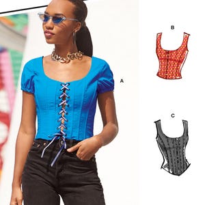 May include: McCall's M8182 sewing pattern envelope featuring a bright blue corset-style top with short puff sleeves and a front lace-up closure. The design includes illustrations for variations B and C, and the hashtag #MonicaMcCalls is printed below.
