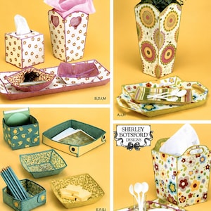May include: Simplicity 4362 sewing pattern for fabric containers. The image displays various fabric-covered storage items including square boxes, rectangular trays, and tall containers with floral and geometric patterns in pink, green, and yellow.