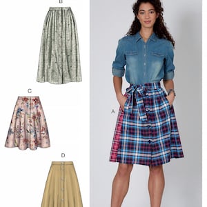 May include: McCall's M7981 sewing pattern envelope featuring four skirt variations. View A is a knee-length plaid skirt with a tie waist and buttons. View B is a long skirt with a leaf print. View C is a floral skirt. View D is a solid tan skirt.