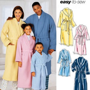 May include: Simplicity 5931 sewing pattern for robes in size A, XS-L/XS-XL. The package features illustrations of four robe variations in yellow, pink, light blue, and dark blue, alongside a photo of three people wearing these robes.