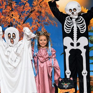 May include: A white ghost costume with silver trim, a pink satin dress with blue ribbons, and a black skeleton jumpsuit with a matching skull mask. A black cat illustration with an orange patterned scarf sits in the foreground.