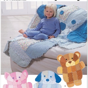 May include: Simplicity sewing pattern S9674 featuring a child's quilt and stuffed animal designs. The image shows a young girl on a blue and white patchwork quilt. Three stuffed animal patterns are shown: a pink bear, a blue dog, and a brown bear.