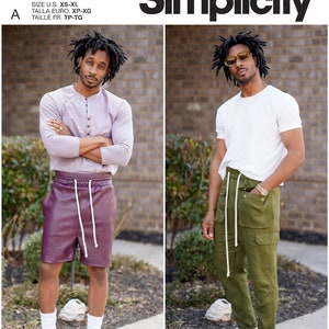May include: Two men modeling different outfits. The man on the left is wearing a light purple long-sleeved shirt, burgundy leather shorts, and white sneakers. The man on the right is wearing a white t-shirt, olive green cargo pants, and white sneakers. Both men are wearing white socks. The text "Mimi G Style" is at the bottom of the image.