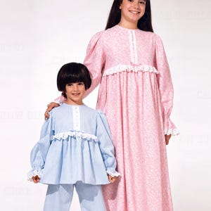 May include: A long-sleeved pink floral floor-length dress with a white lace-trimmed bodice and a light blue and white gingham two-piece set featuring a long-sleeved top and pants with white lace trim at the cuffs and hem, marked with McCall's.
