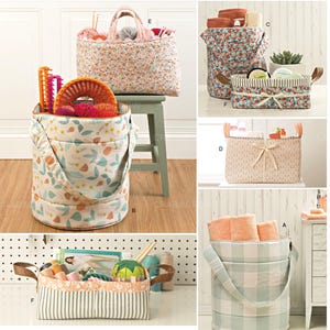 May include: A collection of fabric storage organizers in various shapes and sizes, including cylindrical buckets and rectangular baskets. The items feature floral, plaid, and striped patterns in soft pastel colors, with some designs incorporating fabric handles.