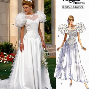 May include: A Vogue Patterns Bridal Original sewing pattern featuring a white wedding dress with a sweetheart neckline, sheer yoke, and voluminous ruffled sleeves. The design includes a full-length skirt with a train and intricate bodice detailing.