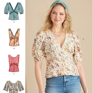 May include: Simplicity pattern S9606 features four blouse designs. The image shows a woman wearing a floral print blouse with a V-neck and short, puffed sleeves. The pattern includes options with lace trim and various sleeve styles.