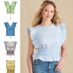 May include: Simplicity sewing pattern S9605 for a women's top with a variety of styles. The pattern includes a green top with a drawstring, a blue top with a V-neck, a floral top with a smocked waist, and a yellow top with a smocked waist. The pattern is labeled "easy-to-sew" and is designed and printed in the USA.