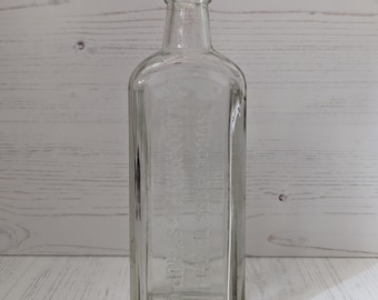 Bottiglia di vetro trasparente Califig vintage, circa anni '20, farmacia