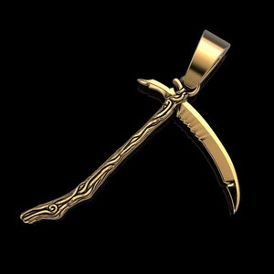 May include: A gold-colored pendant in the shape of a stylized sickle with a detailed design. The pendant has a loop at the top for attaching to a chain.
