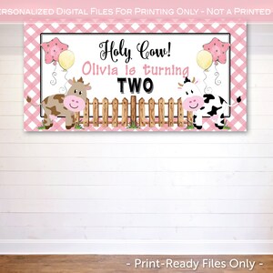 May include: A pink and white gingham banner with a brown and white cow and a black and white cow. The banner says "Holy Cow! Olivia is turning TWO".