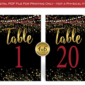 May include: Printable table number cards with a black background, gold confetti, and red string lights. The text "Table" is in gold script font and the table number is in red. The numbers range from 1 to 20.