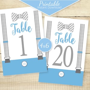 May include: Printable table number cards with a bow tie and suspenders design. The cards are blue, gray, and white. The text on the cards reads "Table 1" and "Table 20".