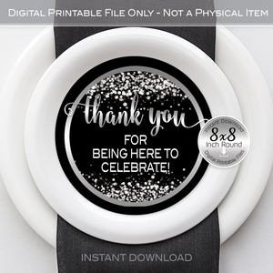 May include: Black and silver printable thank you circle with the text "thank you for being here to celebrate!" and a silver glitter background. The circle is 8 inches in diameter.