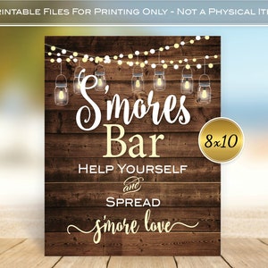 May include: Printable sign for a s'mores bar with a rustic wood background and string lights. The sign says "S'mores Bar" in white text with a gold outline. It also says "Help Yourself and Spread S'more Love" in gold text. The sign is 8x10 inches.
