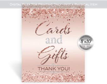 May include: A rectangular sign with a rose gold gradient background and glitter accents at the top and bottom. The text reads "Cards and Gifts" in a mix of script and block fonts, followed by "THANK YOU!" in block letters. An 8x10 inch label is visible.