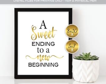 Puede incluir: Un cartel imprimible enmarcado en negro con letras doradas que dice "A Sweet Ending to a New Beginning". El cartel se muestra en una superficie blanca con una pequeña planta en maceta en la esquina. El cartel está disponible en dos tamaños: 8x10 pulgadas y 5x7 pulgadas.
