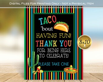 May include: A colorful digital print with a black background and the text "TACO 'bout HAVING FUN! THANK YOU FOR BEING HERE TO CELEBRATE! PLEASE TAKE ONE." The print includes a taco, cactus, maracas, and a sombrero. The sign is 8x10 inches.