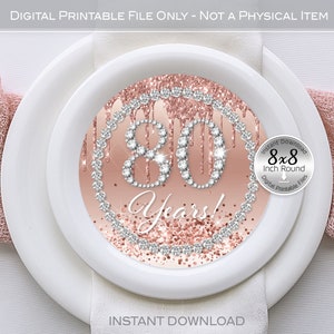 May include: A printable 8x8 inch round digital file featuring a pink and white design with the number 80 surrounded by rhinestones and the text "Years!"
