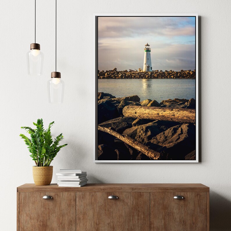 a picture of a light house on the water